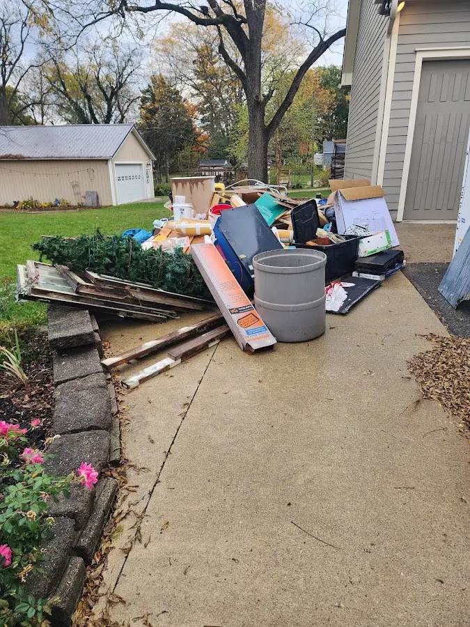 Dumpster being loaded with debris for 12 Yard Dumpster Rental in Berkeley